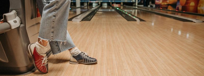 Detail of sports shoes on a wooden floor