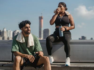 Water bottle and fitness towel on a bench